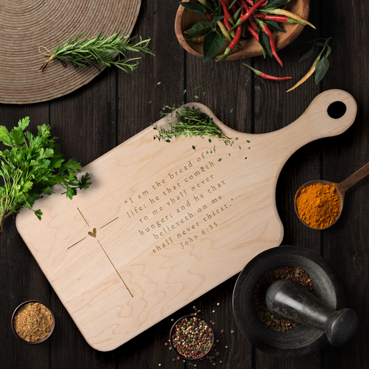 Hardwood_Paddle_Cutting_Board_with_a_cro_Light_Handle_V_Lifestyle_Mockup.png