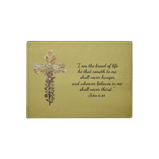 Premium Glass Cutting Board featuring a delicate floral cross and the inspirational quote that our Lord is the Bread of Life